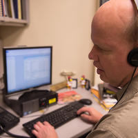 Mike Hoenig, a program coordinator in the Center for Disabilities and Development at UI Stead Family Children’s Hospital, uses a screen-reading program on the computer. 