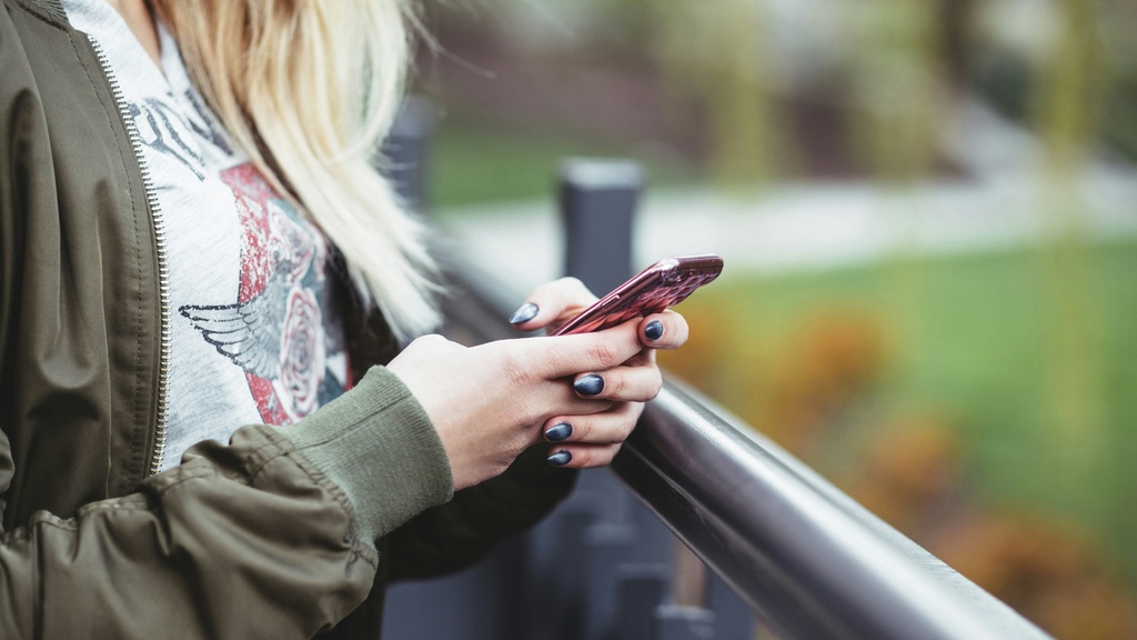 Person holding mobile phone